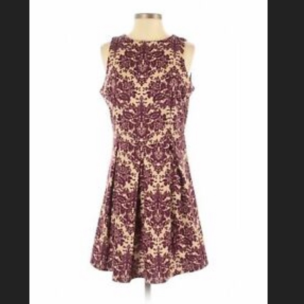 Purple fit and flare dress from Charming Charlie’s